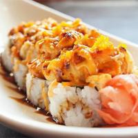 19. TNT Roll · Crabmeat, avocado topped with torched tuna, salmon, crab salad and masago.