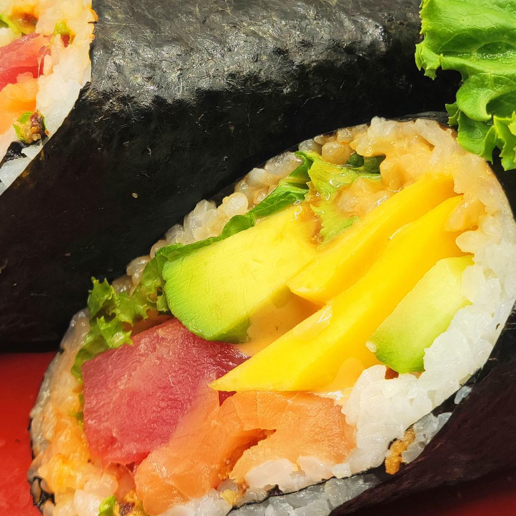 22. Tropical Ocean Queen Roll · Tuna, salmon, avocado, cucumber, mango, green leaf, crunchy onion and spicy sauce, sweet sushi sauce.