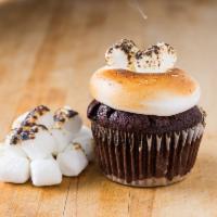 S'mores cupcake · Dark choc cake torched meringue, topped with toasted marshmallow, and don’t forget the graha...