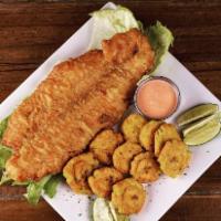Pescado Frito / Fried Fish · Crispy golden Fried fish served with two sides 
