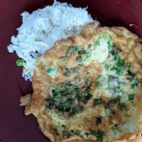 Scallion Omelette over Rice (Kai Jeow) · Fried fluffy egg omelette with scallions, served over steamed jasmine white rice