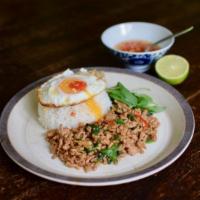 Pad Basil over Rice with Fried Egg (Pad Kra Pow) · Ground meat sauteed with bell peppers, onion, and garlic in a spicy basil sauce, served over...