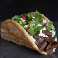 Gyro Wrap · Lettuce, red onion, tomatoes and Z-sauce wrapped in a grilled pita.