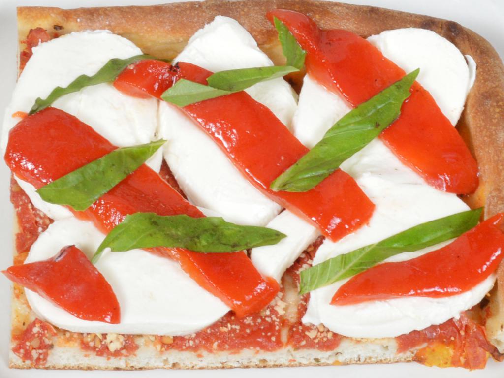 Grandma Pizza Slice · Fresh tomatoes, fresh mozzarella, roasted peppers and basil.