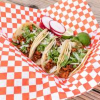 Tacos · Your choice of meat, fresh cilantro and onions on a double soft corn tortilla shell

