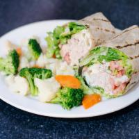 21. Tuna Melt Wrap · Tuna salad, mozzarella cheese, leaf lettuce and tomatoes.