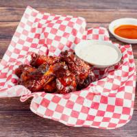 Loft Wings · Served with Irish whiskey sauce and loft dressing hot or mild.