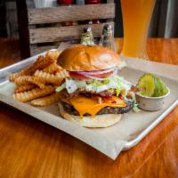 Angus Breakfast Burger · Topped with cheddar cheese, fried egg, bacon, lettuce, and tomato w/ Fries