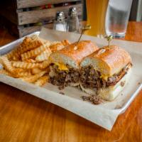 Philly Cheese Steak · Juicy slice steak with sauteed onions, fries. Choice of American, cheddar or zesty cheese sa...