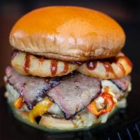 Brick House & Fries · 1/3 lb. beef patty topped with smoked brisket, onion, Texas Sweet-slaw, Jack cheese, onion r...