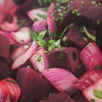 Beet Salad · Fresh beet and red onion over mixed greens, tomato, olives, crumbled blue cheese, and balsam...
