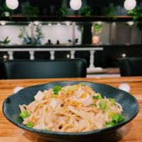 Garlic Noodles · Even Vampires love these noodles! 
Flat wheat noodles with Minced Chicken or Tofu. Topped w...