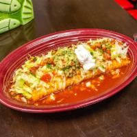Burrito Azada · Flour tortilla filled in with roasted meat, rice and beans. Topped with special salsa, chees...