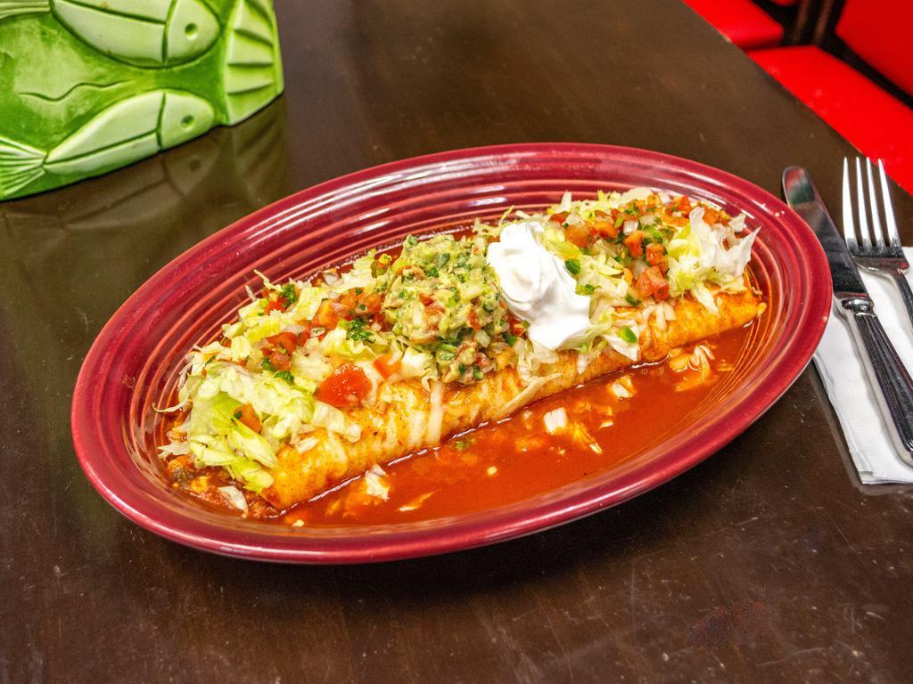 Burrito Azada · Flour tortilla filled in with roasted meat, rice and beans. Topped with special salsa, cheese, sour cream and guacamole.