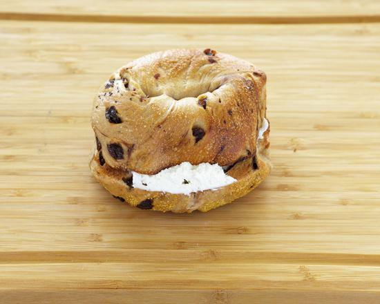 Cinnamon Raisin Bagel with Cream Cheese · Fresh cinnamon raisin bagel smothered with cream cheese.