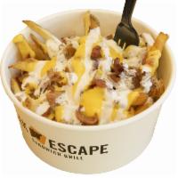 Totally Loaded Fries · Fresh curt fries topped with crispy bacon, smothered with melted cheddar and ranch dressing.