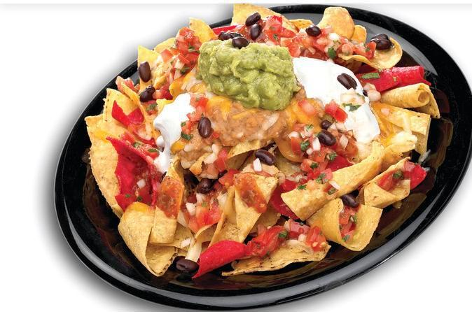 Seasoned Beef Nachos Grande · Corn tortilla chips topped with cheddar and pepper jack cheese, homemade salsa fresca, refried pinto beans, sour cream, guacamole and seasoned beef