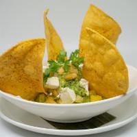 Garden Guacamole · Salsa Tropical and Queso Fresco, Spiced Tortilla Chips 