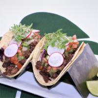 CARNE ASADA   · Diced Grilled Steak, Red Cabbage, Pico de Gallo, Tomatillo Salsa 