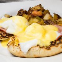 Eggs Benedict · Served with herb roasted potatoes or french fries and toast. 