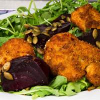 Red Beet Salad · Baby arugula, fried goat cheese and toasted pumpkin seeds tossed in a citrus vinaigrette wit...