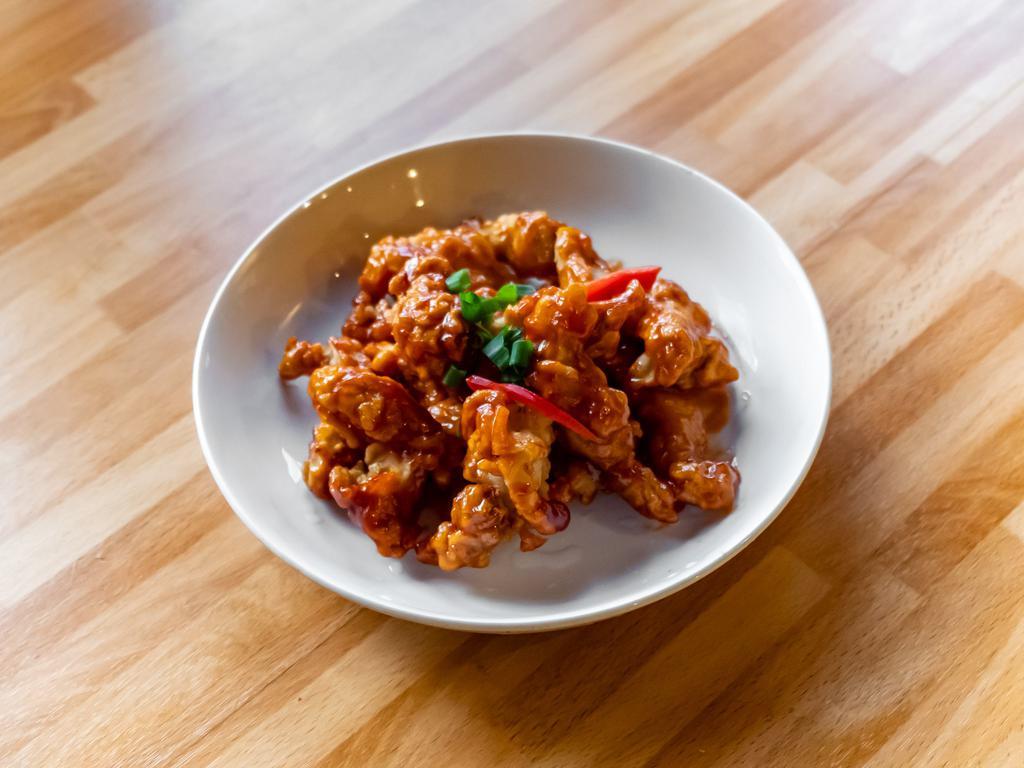 Orange Chicken · 8 pieces. Battered and deep-fried chicken strips of chicken breast, sautéed in sweet and sour sauce.