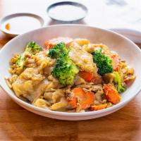 Pad See Eiw · Stir-fried wide rice noodle in dark soy sauce with your choice of meat, egg, broccoli, carro...