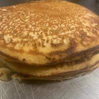 Pancakes · 3 pan sized pancakes.  Comes with unsalted butter & maple syrup.