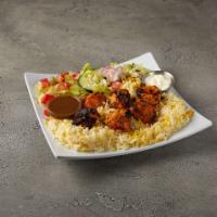 3. Chicken Kabob · Perfectly seasoned Chicken kabob Basmati rice , Greek salad, Tzatziki and Pita