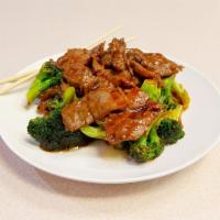 83. Beef with Broccoli · Served with rice.