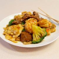 S9. Triple Delight · Sliced beef, chicken and jumbo shrimp sauteed with Chinese vegetable in oyster sauce. Served...