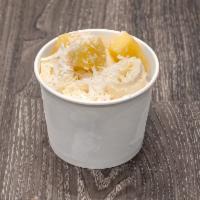Pina Colada · Pineapple and coconut flakes.