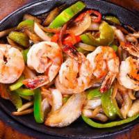 51. Shrimp Fajitas · Sizzling marinated shrimp on a bed of sauteed onions and peppers.
