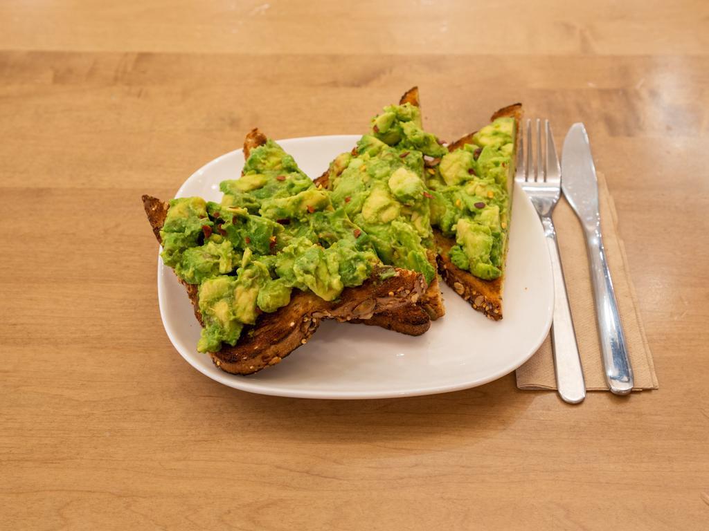 Avocado Toast · Seasoned & smashed avocado sprinkled w/ red pepper flakes on toasted multigrain bread.