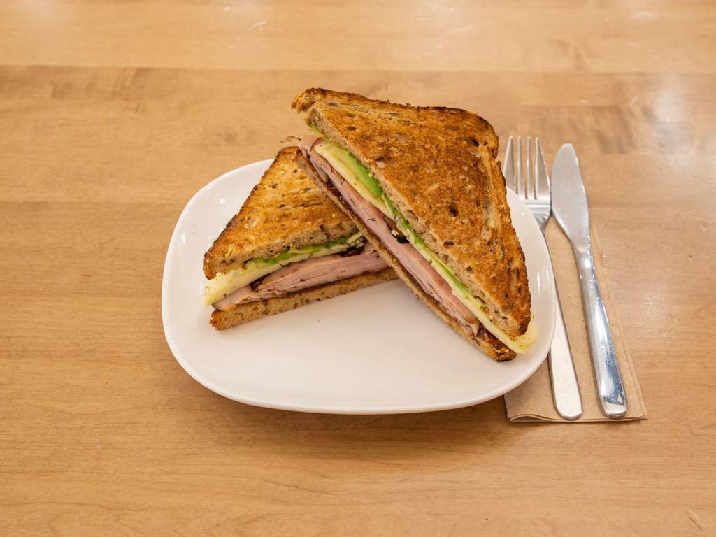 Crestwood Sandwich · Sliced honey maple turkey, brie cheese, sliced avocado and homemade drunken fig jam on toasted multigrain bread.