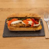 Milano Sandwich · Marinated grilled chicken breast, roasted red peppers, fresh mozzarella and homemade pesto o...