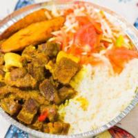 Curry Goat Lunch · Served with choice of rice and peas, white rice or provisions. Includes vegetable and planta...