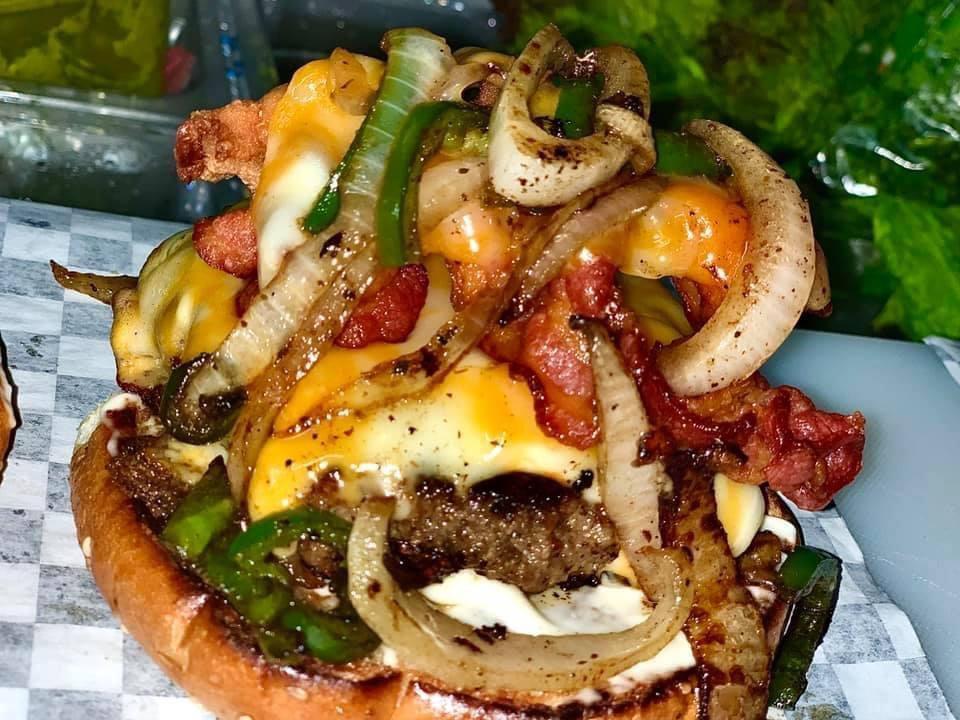 Boil Bar Burger Basket · Bacon cheese burger with onions, lettuce, tomatoes, pickles, mustard or mayo with buns toasted to perfection. Served with fries.