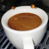 Espresso (Double Shot) · Water under pressure through of finely ground coffee beans.