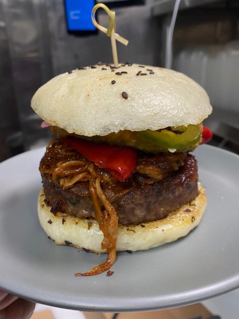 Impossible BBQ Burger · impossible burger, caramelized onion, bbq mushrooms, pepper jack, house pickle, spicy mayo, avocado rings