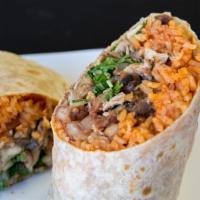 Grilled Steak Burrito · a giant buritto filled with grilled steak, a mound of rice, black beans, guacamole, sour cre...