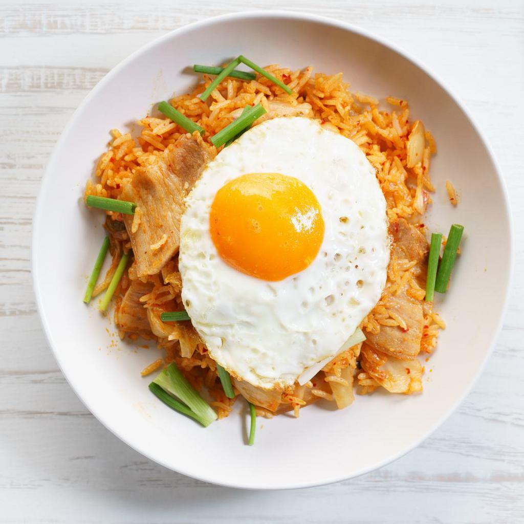 Kimchi with Egg Bokkum Bap · Korean stir-fry rice with diced onions, carrots and scallion with oyster sauce or soy sauce, topped with chopped kimchi and egg.