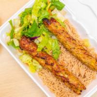 6. 2 Chicken Kabobs Platter · Served over rice and salad with white or hot sauce. 2 long chicken kabobs cooked in a tandoo...