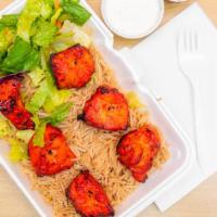 7. Chicken Breast Platter · Served over rice and salad with white or hot sauce. 6 tandoori pieces of chicken breast over...