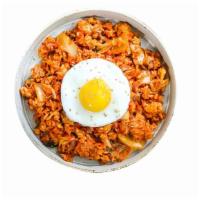 Kimchi Fried Rice · Kimchi fried rice with scrambled egg and fried egg on top. 
with choice of your topping.