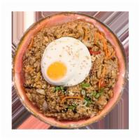 Teriyaki Fried Rice · Teriyaki fried rice with scrambled egg and fried egg on top.
 with choice of your topping.