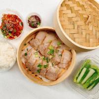 Pork Wraps (Bossam) · Boiled pork with napa cabbage, spicy radish, and bean paste (ssamjang) sauce.