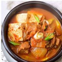 Kimchi Stew (kimchi chigae) · Spicy kimchi stew with pork, tofu, rice cake, glass noodles.