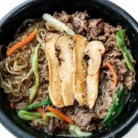 Bulgoki Dook Bae Ki (bulgoki hotpot) · Marinated thin slices of beef rice cake and glass noodle soup.