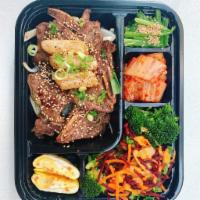 BBQ Lunch Box  · Korean styled marinated beef BBQ lunch box, comes comes with a white rice, side dishes.